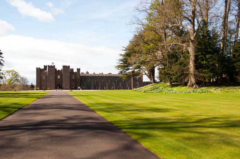 Perthshire, Scotland - May 5, 2013: Tourists walk the grounds around Scone Palace in Perthshire on a sunny spring day as tourism season ramps up.